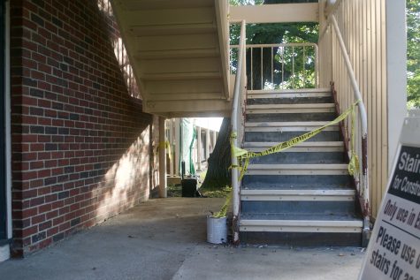 A staircase under repair at a Forest Park apartment. Repairs were made to keep buildings suitable for living until demolition in 2019. Photo by Jordyn Haime / TNH staff