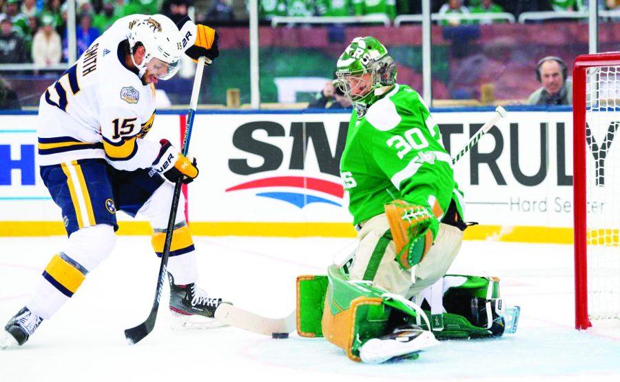 Dallas Stars goaltender Ben Bishop (30) blocks the shot of Nashville Predators right wing Craig Smith (15) in the first period of the NHL Winter Classic hockey game at the Cotton Bowl, Wednesday, Jan. 1, 2020, in Dallas. (AP Photo/Jeffrey McWhorter)