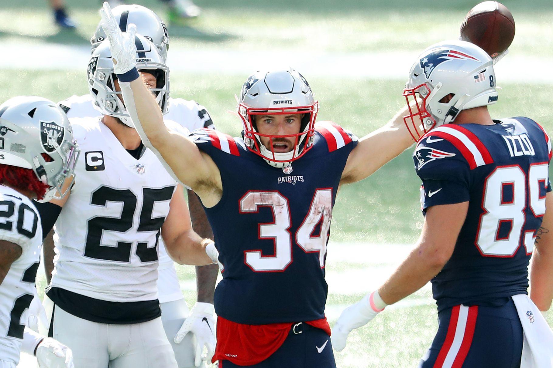 New England Patriots running back Sony Michel (26) tries to break free from  Las Vegas Raiders d …