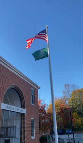 Durham, NH- The flag of the Cowasuck Band of the Pennacook-Abenaki People hangs outside town hall.