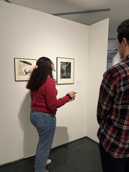 Natalia Tomahatsch (class of 2026), an intern for the Museum of Art at the Paul Creative Arts Center, facilitating a talk on Sue Coe’s photo etchings.