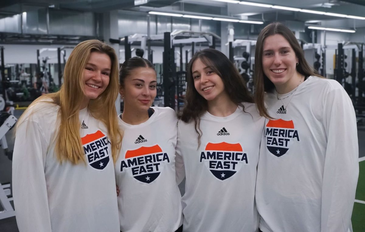 (From left to right) Hannah Serbousek, Miray Keskin, Ezgi Karabulut, and Marisa Armer wearing shirts with the new America East logo design.