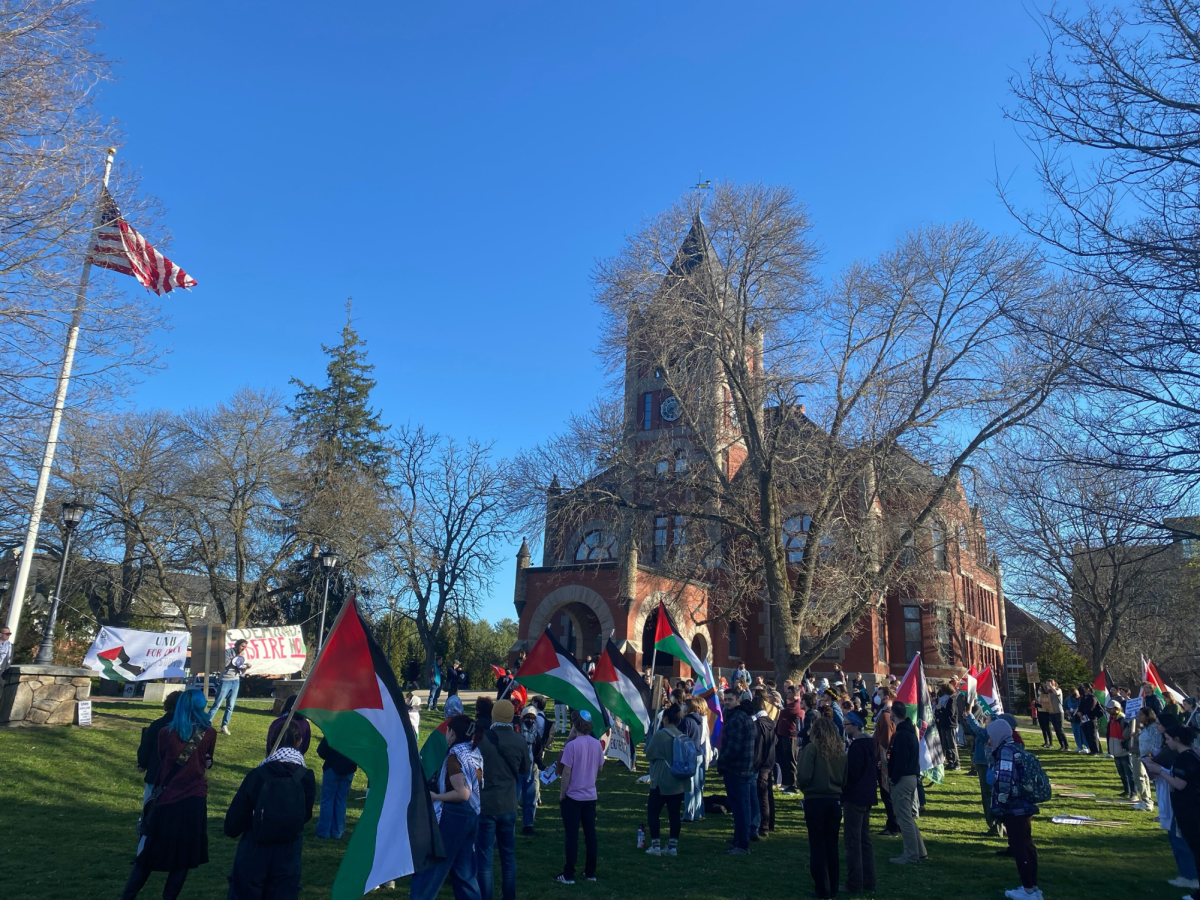 Protesters gathered on Thompson Hall Lawn Thursday evening in solidarity with Palestine and to demand UNH pull funding from Israeli-based businesses amidst the ongoing crisis in Gaza. 
